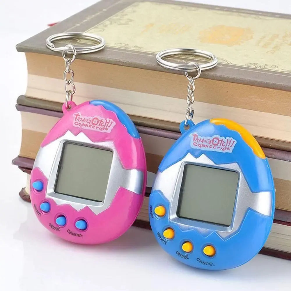 Elektorninis žaislas Tamagotchi – virtualus augintinis su spalvingu ekranu ir mygtukais, skirtas vaikų pramogoms ir priežiūrai.