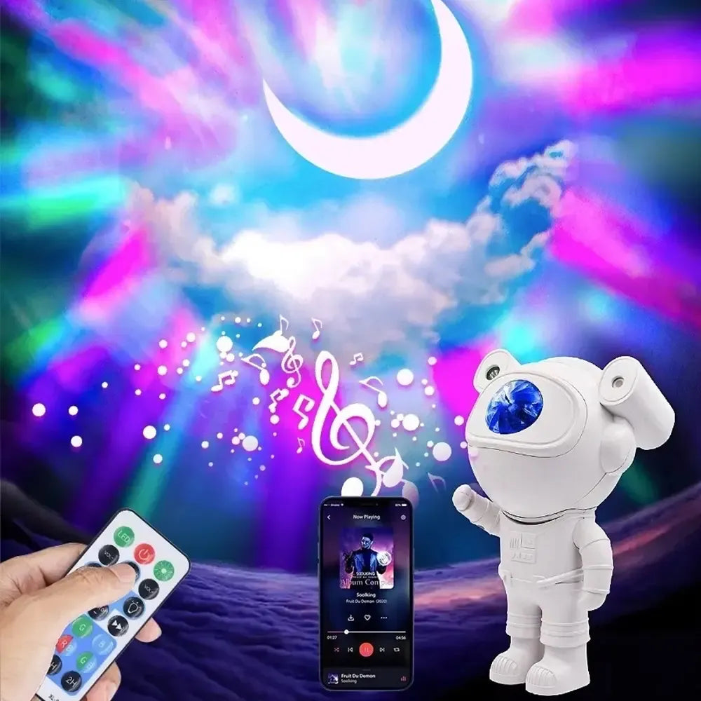 LED projektorius su kolonėle, rodo astronauto vaizdą, skirtas vaikų kambariui, su šviesos ir garso funkcijomis.