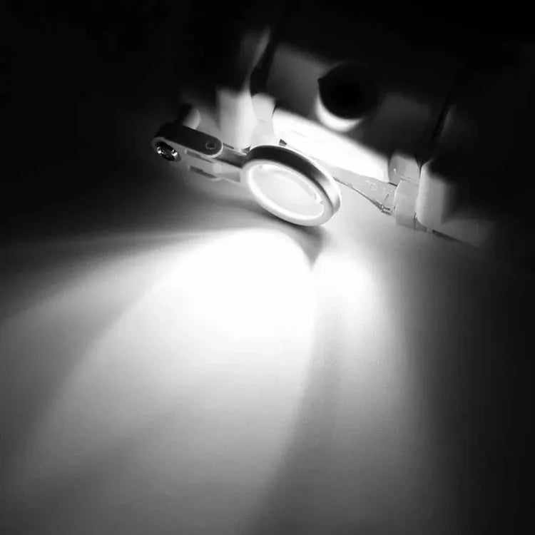 Ant galvos tvirtinamas didinamasis stiklas su LED apšvietimu