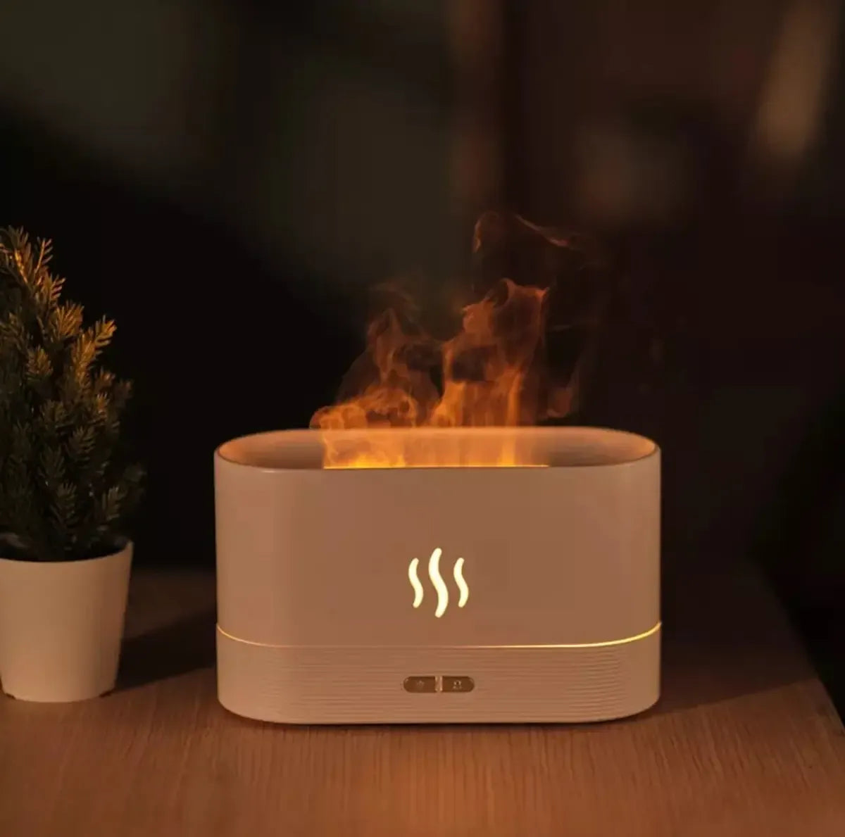 Ultragarsinis oro drėkintuvas su liepsnos imitacija ir LED apšvietimu, skaidrus korpusas, šviesos efektai ir modernus dizainas.