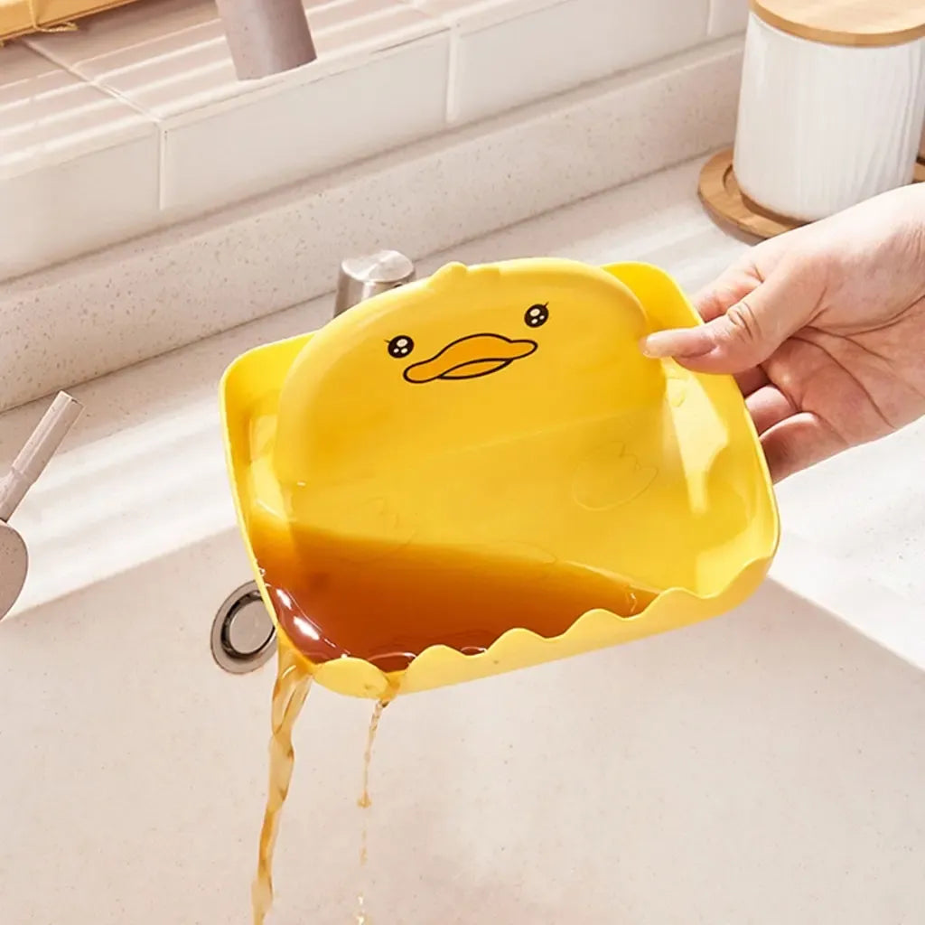 Plastikinis universali virtuvės įrankių laikiklis Duck, skirtas saugiai laikyti šaukštus, peilius ir kitus virtuvės įrankius.