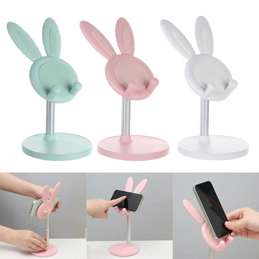 Telefonų stovas Rabbit, kompaktiškas ir lankstus, pagamintas iš minkštos medžiagos, stabiliai laiko telefoną ant stalo.