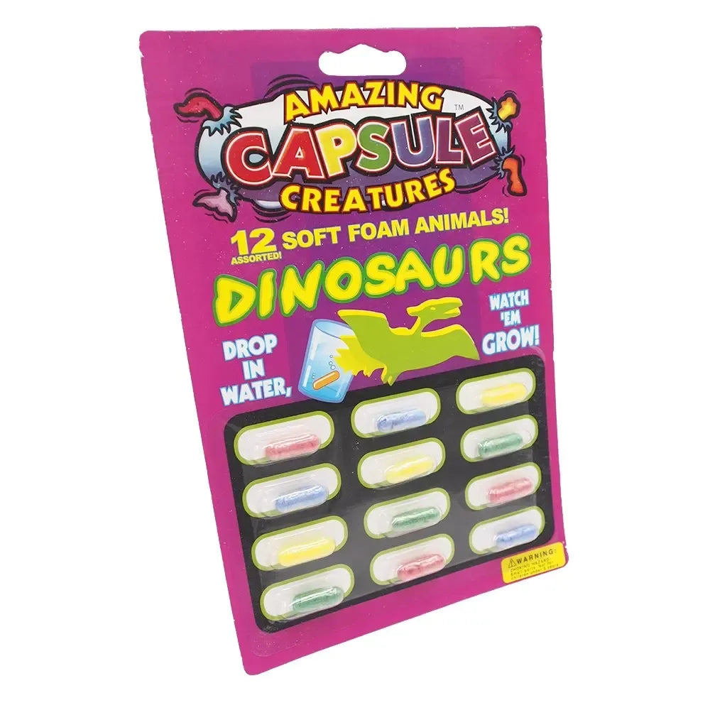 Vandeniui atsparios augančios kapsulės Dinosaurus, parodyta jų išvaizda vandenyje, su ryškiomis spalvomis ir detalėmis